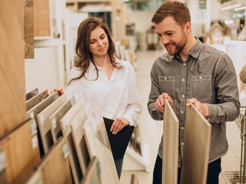 young couple looking at flooring samples | 1 McCain Blvd, West Memphis, AR 72301