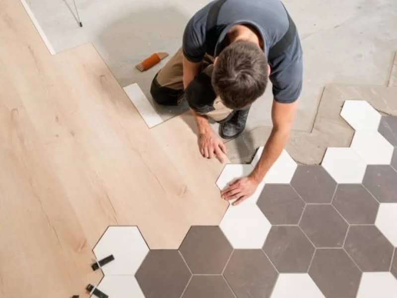 flooring installer combining ceramic and wood flooring in a modern pattern | 1 McCain Blvd, West Memphis, AR 72301
